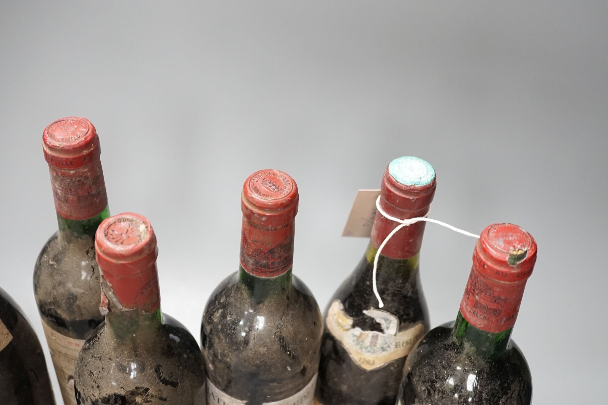 Six various bottles of red wine including two bottles of Château La Lagune 1976 etc.